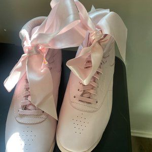 Reebok Freestyle Satin Bow High Top Sneakers in Porcelain Pink